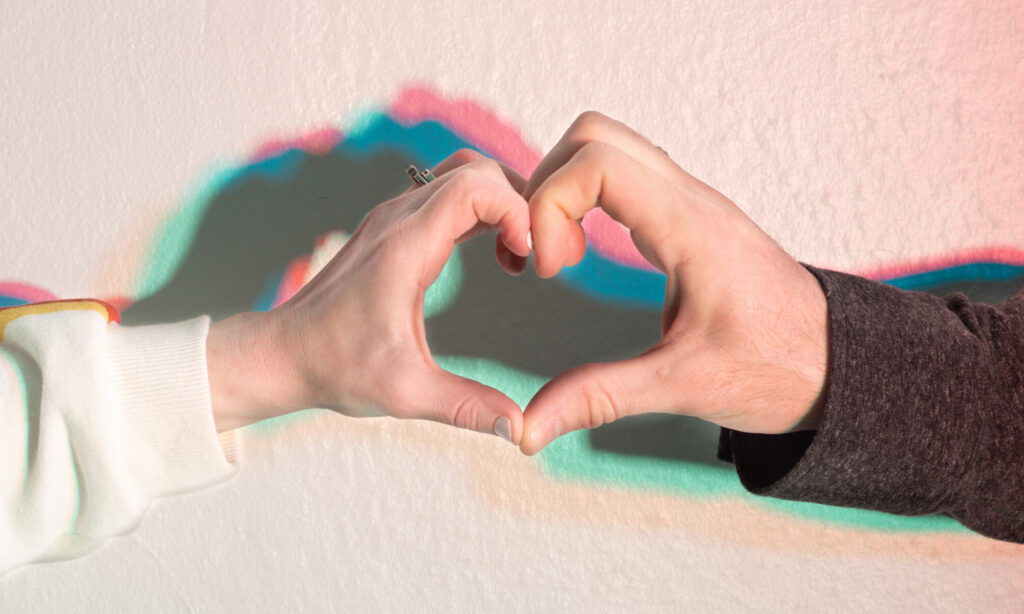 Our hands pressed together to form a heart.