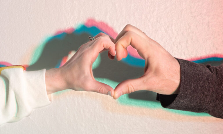 Our hands pressed together to form a heart.